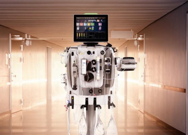 PrisMax 2 machine in a hospital hall setting with backlighting 				