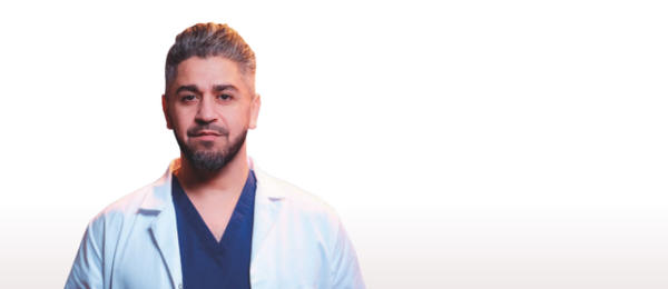 Doctor seen from the front  in a lab coat 
